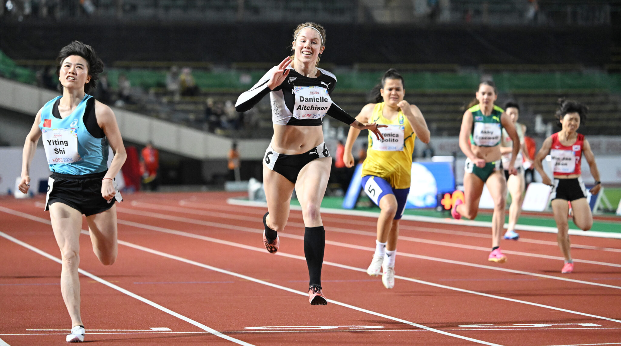 Aitchison celebrates silver in record-breaking 100m final